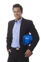 Wall Mural - Happy Asian businessman holding hardhat