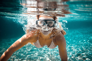 Wall Mural - Snorkeling woman in the tropical sea