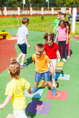 Agility and cleverness on the playground in the summer outdoors