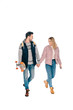 © LIGHTFIELD STUDIOS - beautiful happy young couple holding hands and walking together, man holding skateboard isolated on white
