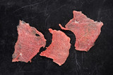 Fototapeta  - Zrazy z wołowiny. Plastry polędwicy wołowej na ciemnym tle.