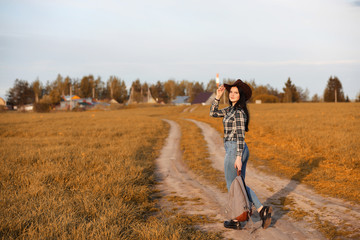 A young girl is traveling around the city hitchhiking. A beautif