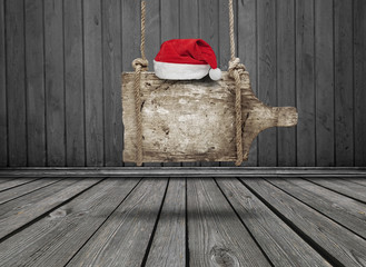 black banner with red  Santa hat of wood in interior