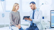 © Gorodenkoff - Beautiful Female Visits Doctor's Office, He Shows Tablet Computer with Her Medical History They Discuss Her Health and Other Medical Issues. Modern Medical Office.