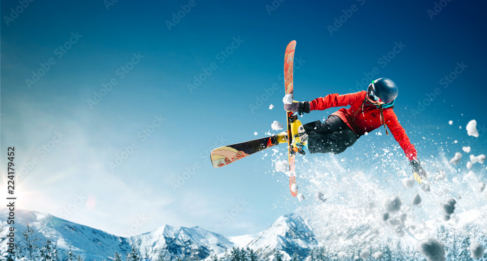 Skiing. Jumping skier. Extreme winter sports. - obrazy, fototapety, plakaty 