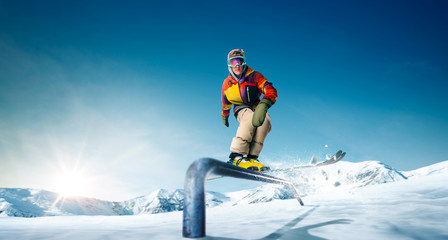 Wall Mural - Skiing. Jumping skier. Extreme winter sports.