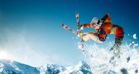 Wall Mural - Skiing. Jumping skier. Extreme winter sports.