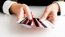Closeup Image Of Female Hands Holding Lots Of Credit Cards