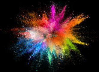 Colored powder explosion on black background.