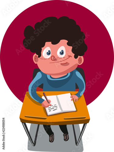 School Age Boy Sitting On The Desk And Writing The Notebook