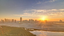 Buildings On Al Reem Island In Abu Dhabi At Sunset Timelapse From Above.