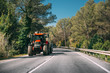 © Great Brut Here - Tractor With Fertilizer Applicator With Tank In Motion On Countr