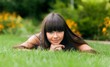 © BillionPhotos.com - Portrait of a Young Woman Lying Down on the Grass