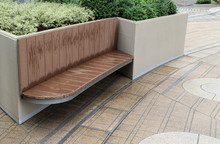 Closeup Of Designed Outdoor Wooden Seat With Natural Background After Raining.
