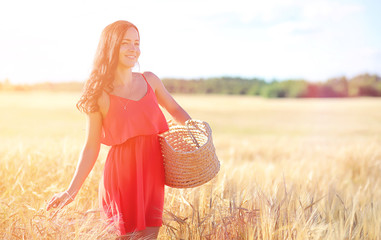 Young girl in a wheat field. Summer landscape and a girl on a na