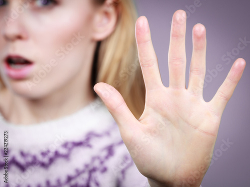Fotografija Woman making stop gesture with open hand