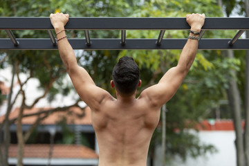 Wall Mural - Man doing fitness in outdoor park