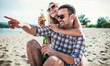 © bobex73 - Beautiful young couple having fun on the beach. Lifestyle, love, dating, vacation concept