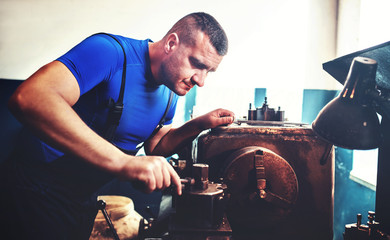 Operator working on the lathe machine. Concept of industry