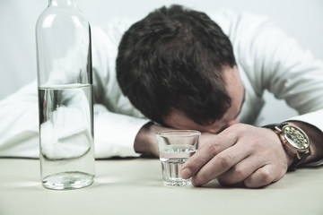 Wall Mural - Caucasian alcoholic businessman with a vodka.