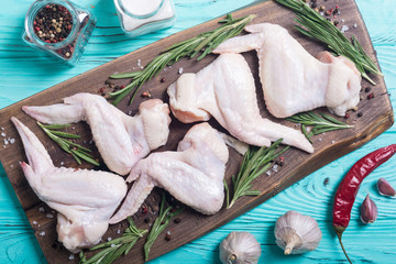 Poster - Chicken raw wings with rosemary , garlic , pepper and salt