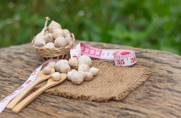 Wall Mural - Elephant Garlic bulb head and cloves on wooden floor, Herbs and spices.