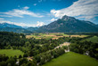 © tamas - Aerial panorama of yellow Hellbrunn palace castle with scenic garden below the Alps in Salzburg Austria former residence of the bishop