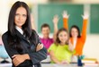 © BillionPhotos.com - Female teacher with children at class on