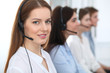© rogerphoto - Call center. Beautiful cheerful smiling operator consulting clients with headset. Business concept of customer service
