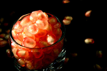 Wall Mural - Pomegranate Seed on black background