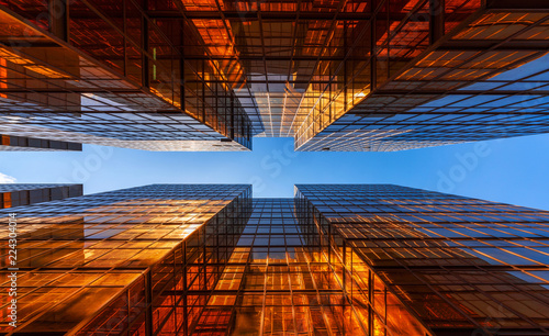 golden-building-with-blue-sky-windows-glass-of-modern-office-skyscrapers-facade-design-architecture-exterior-for-cityscape-background