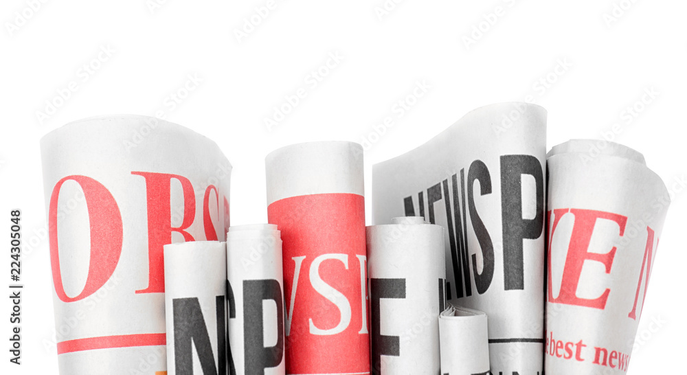 Folded newspapers on white background