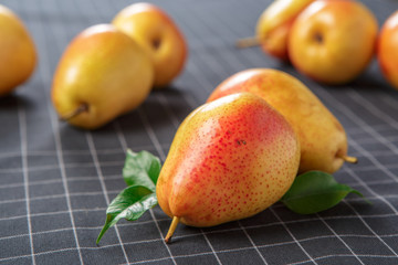 Sticker - organic pears laying down on a lightly dotted kitchen cloth