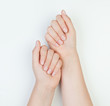 © artmim - Beautiful female hands together on white background. Manicure concept