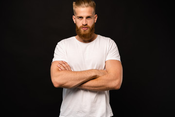 Handsome young guy posing in studio - isolated.