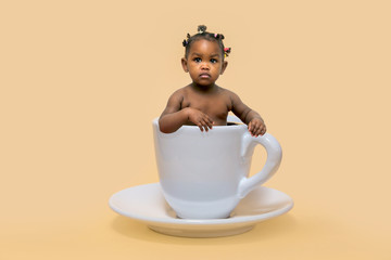 Baby in a coffee cup