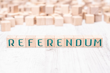 Wall Mural - The Word Referendum Formed By Wooden Blocks On A White Table