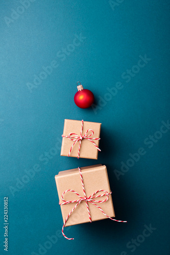 Gift boxes wrapped in kraft paper and tied with candy cane Christmas rope and...