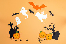 Flat Lay Halloween Background With Cartoon Cemetery, Pumpkins And Ghosts.