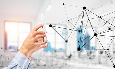 Business and technology concept with networking grid and man using device