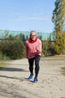 © 2Design - Senior man wearing glasses jogging at the park