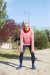 © 2Design - Active senior runner in red sweatshirt in nature resting.