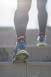 © 2Design - Athlete runner feet running in nature, closeup on shoe.