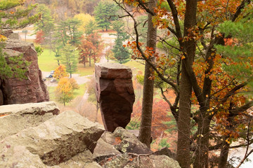 Wall Mural - wisconsin ice age nature background. autumn landscape with balanced rock on south shore hiking trail
