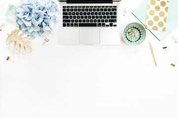 Wall Mural - Home office desk workspace with laptop, hydrangea flowers bouquet, accessories on white background. Flat lay, top view decorated mockup.