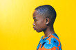 © Gerald Carter/Creative Flame - Studio portrait of boy wearing traditional African clothing