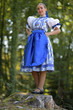 © muro - Young beautiful slovak woman in traditional costume. Slovak folklore.