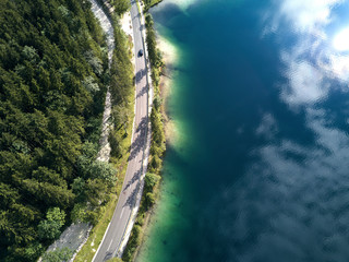 Wall Mural - Aerial view of the road near the lake and the forest from above