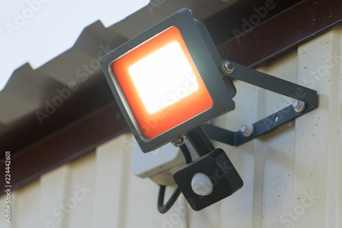 Fotografie, Obraz Led spotlight with motion sensor. Place for your text.