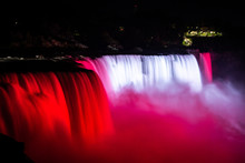 NIagara Falls Illuminated With Color Lights At Night